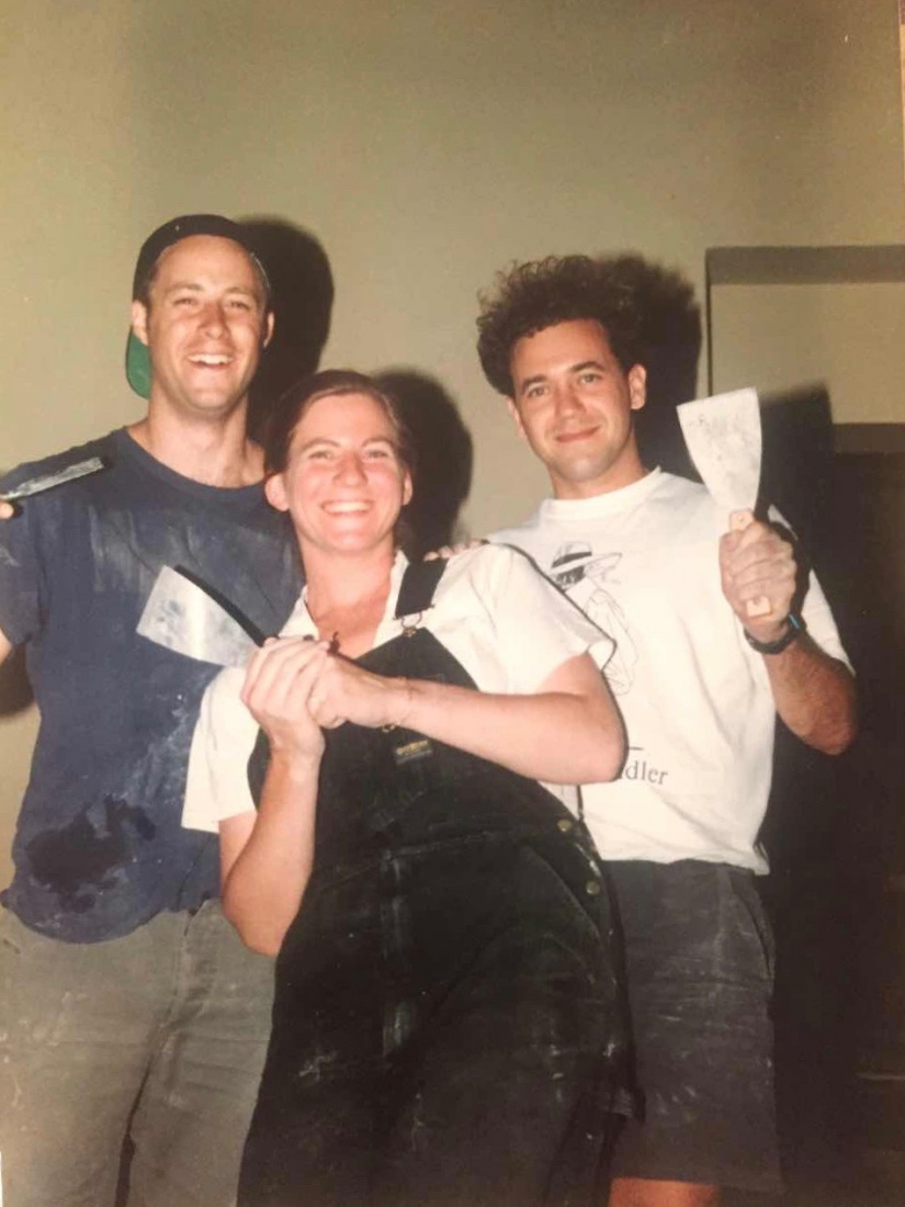 Jasper Bear, Markéta and Scott Rogers posing with floor-scrapers during renovations prior to opening for The Globe Bookstore and Coffeehouse in Holešovice, Prague. June/July 1993. Photo courtesy of Scott and Markéta Rogers. 