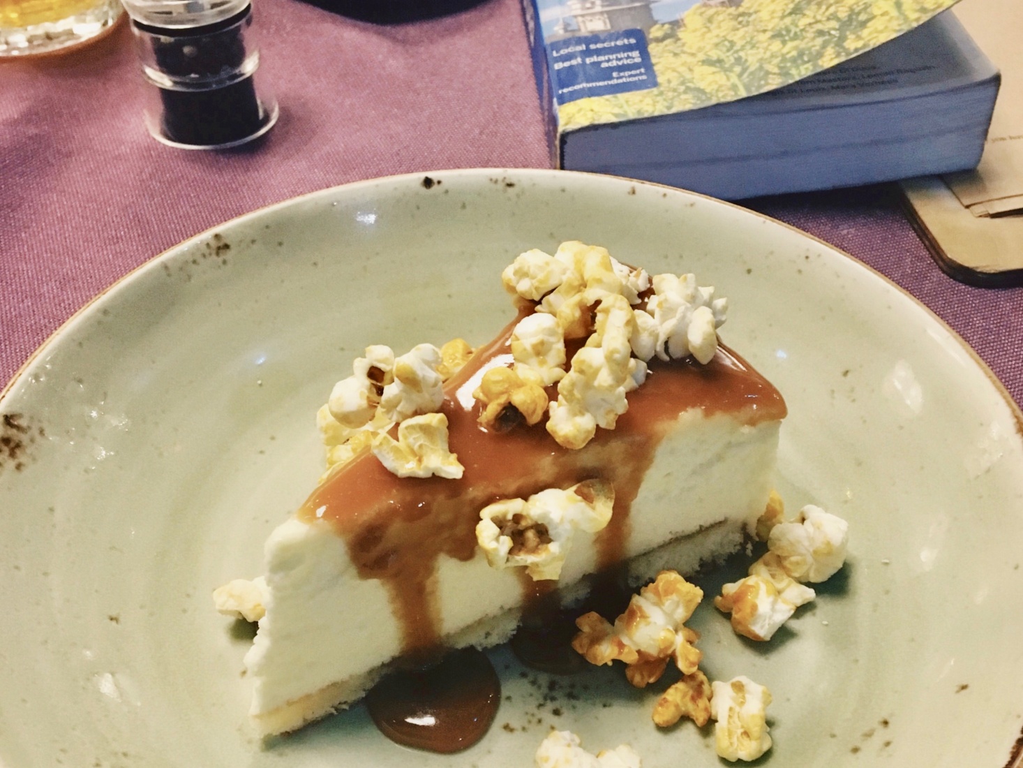 Popcorn topped cheesecake in Astrakhan, Russia, showing variety of desserts and cultural delicacies available through travel.